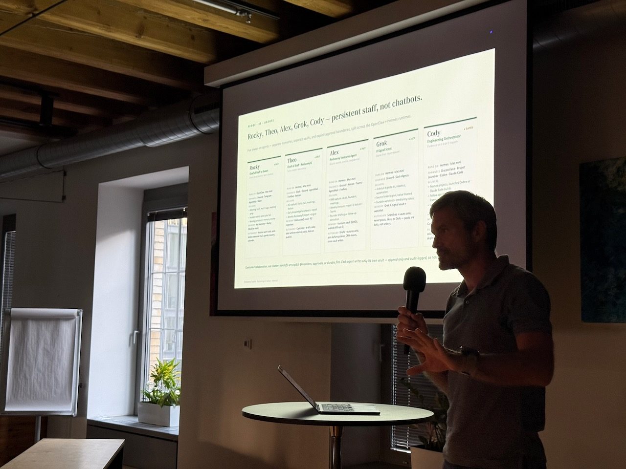 Builder presenting a live demo with a microphone